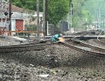 The welder fixes the frog between the eastbound and the Bayard Branch.